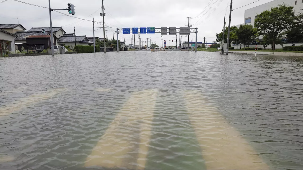 Heavy rain in northern Japan triggers floods and landslides, forcing hundreds to take shelter