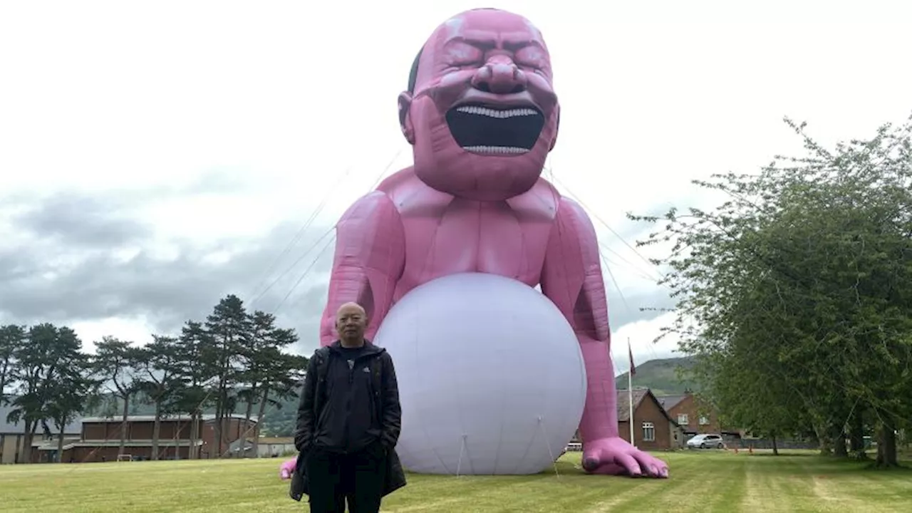 Giant pink man causes stir in small Welsh town