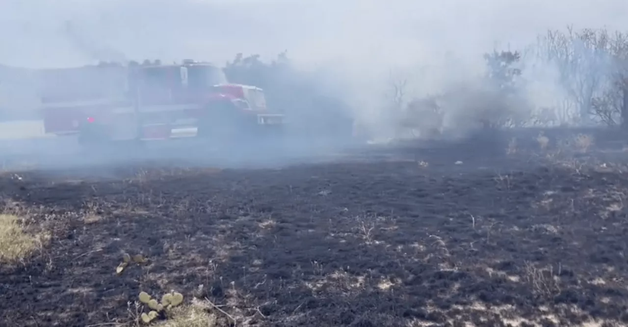 Grass fire along I-25 sends up smoke, slows traffic near Castle Rock