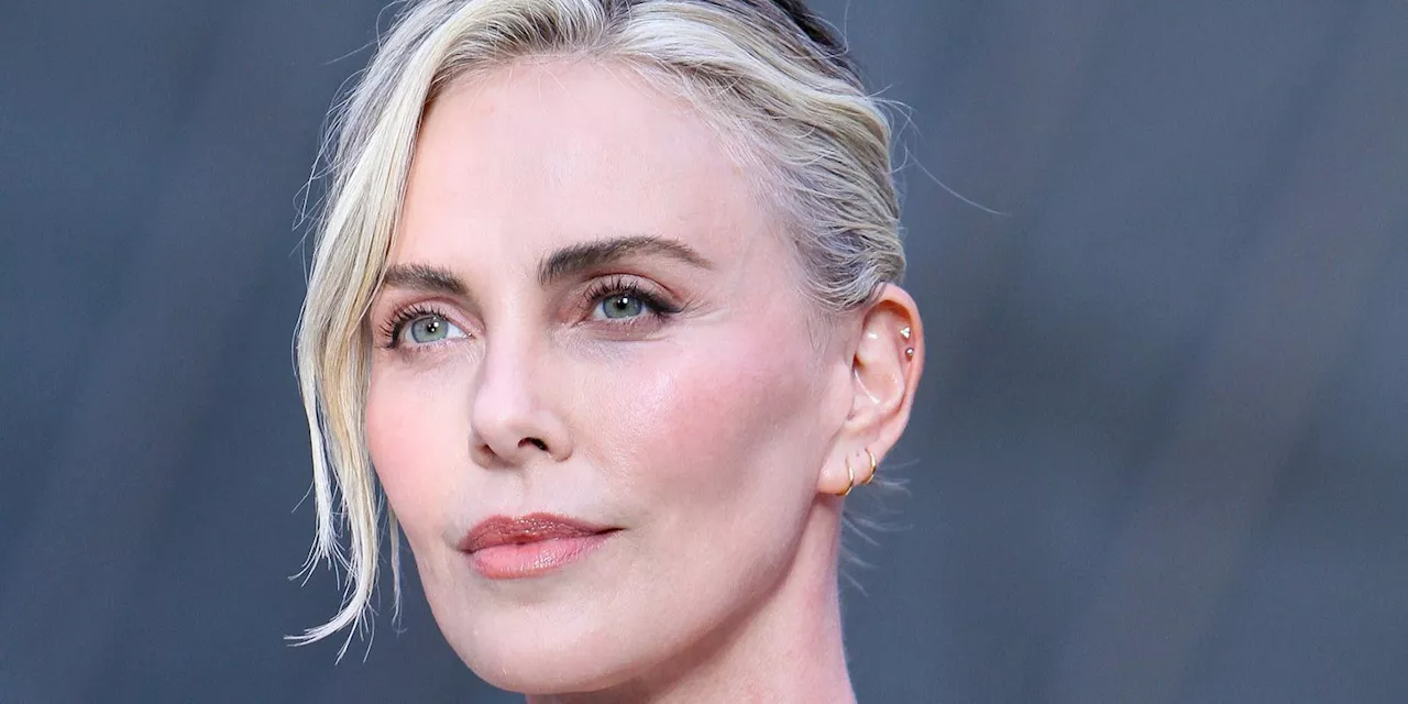 Charlize Theron Looks Statuesque in a Sleek White Minidress at Pre-Olympics Event