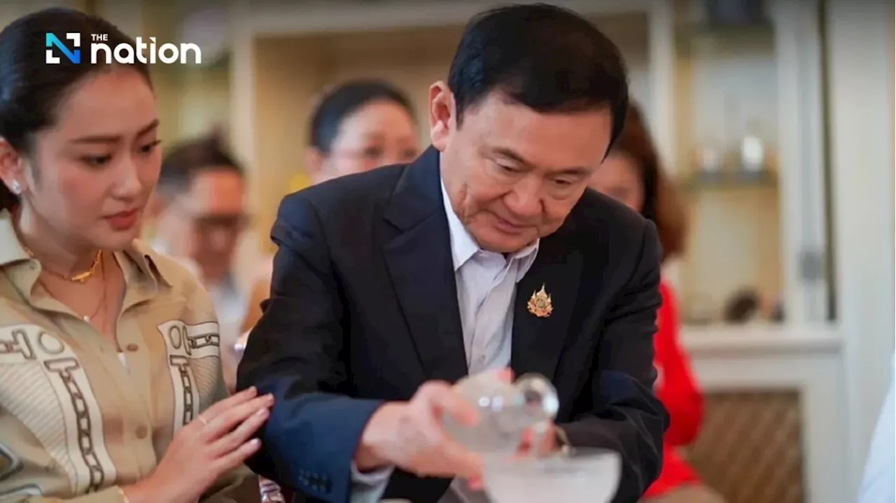 Family members, ministers and Red Shirts greet Thaksin as he turns 75