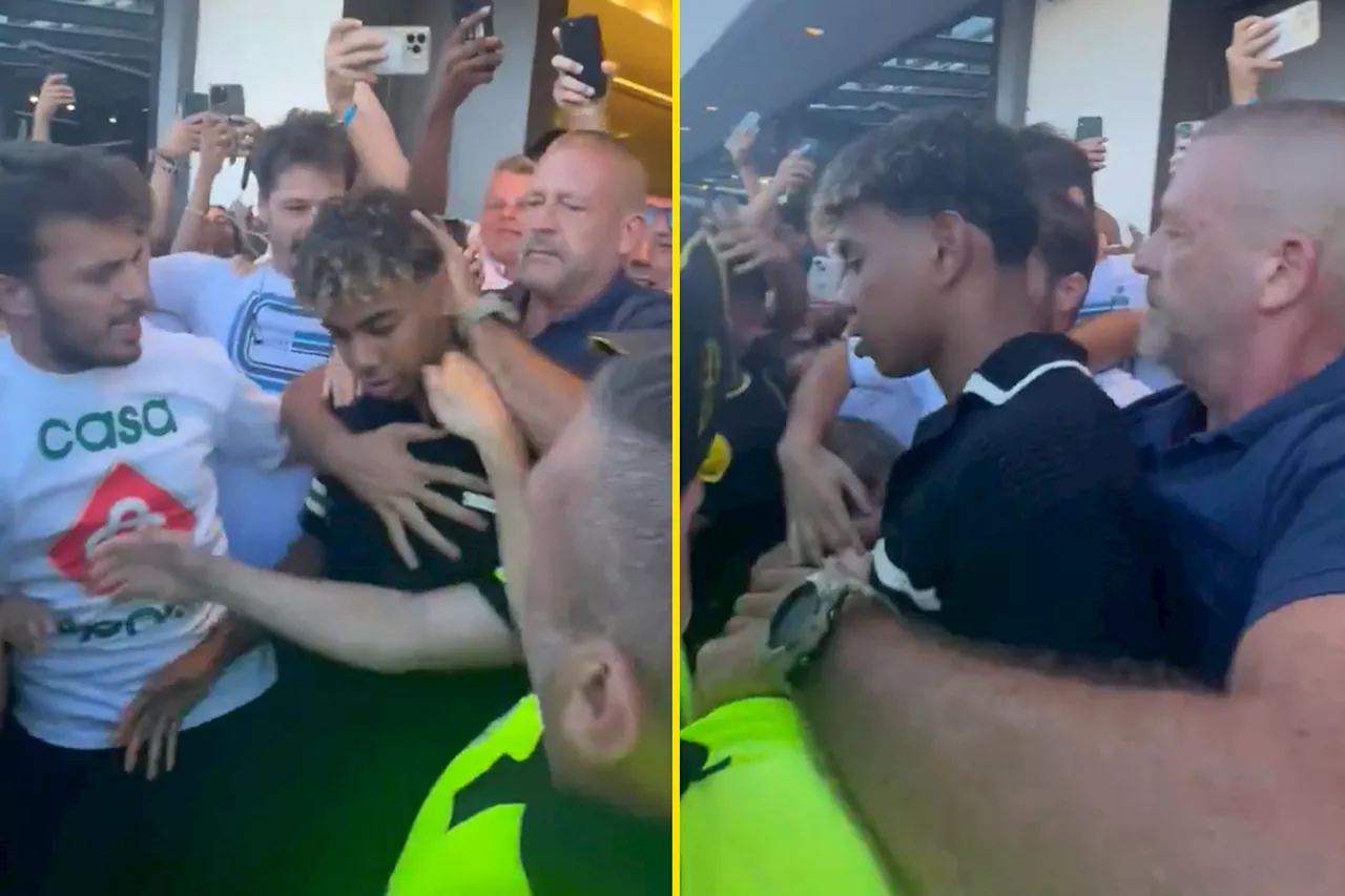 Security struggle to keep fans back as Lamine Yamal is mobbed at airport in Spain...