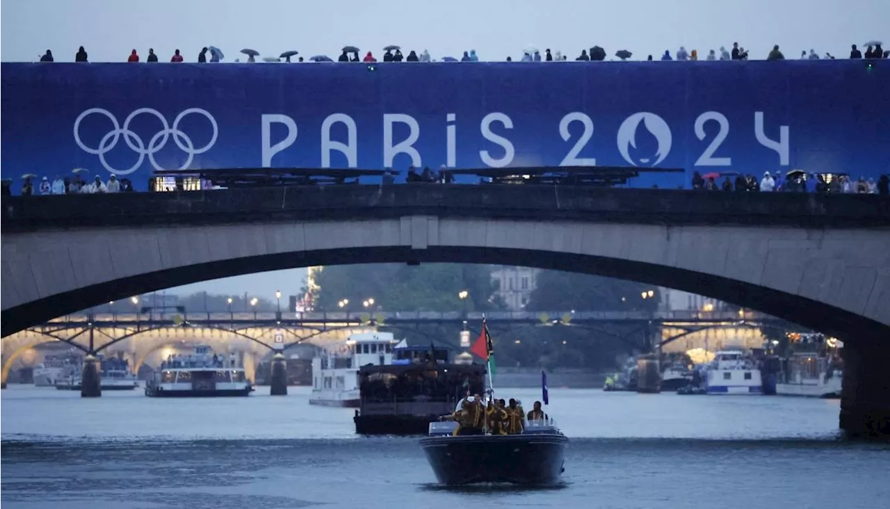 Teams sail down Seine in rain-soaked Olympics opening ceremony