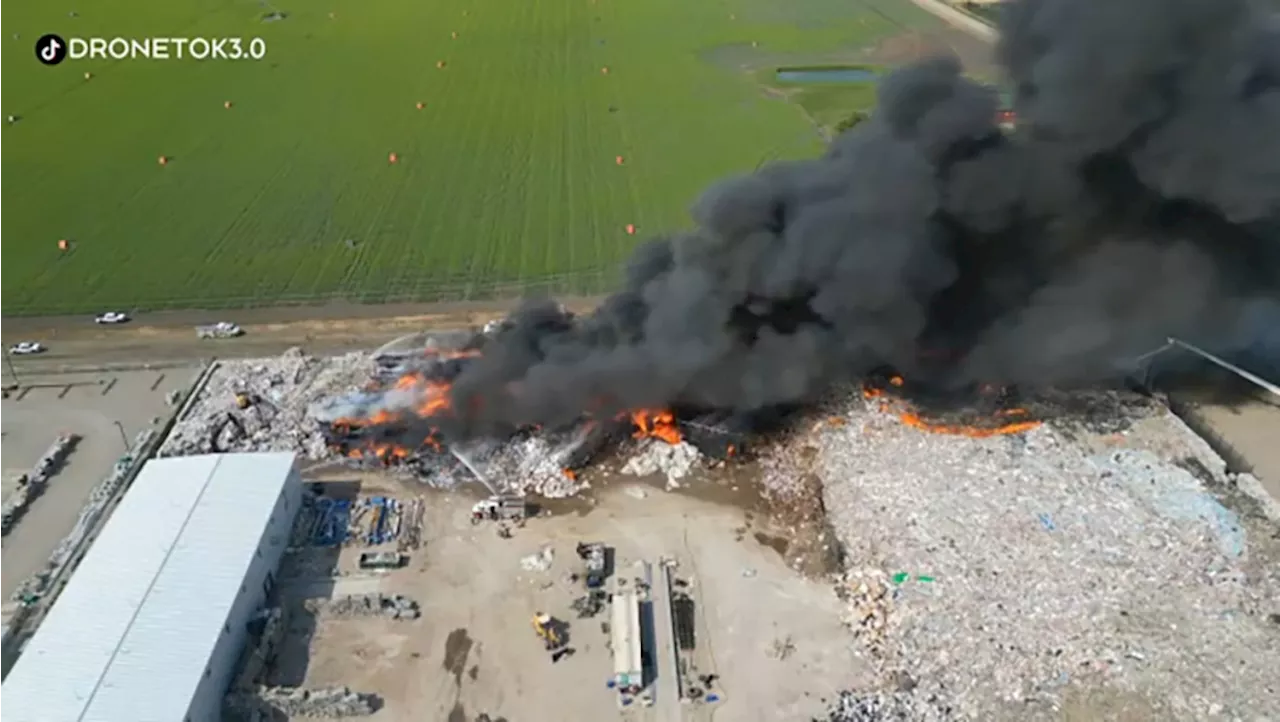 Fire crews from across southern Alberta fight large fire at Coaldale recycling plant