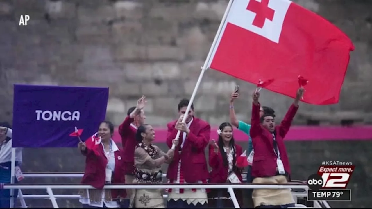 San Antonio resident Aki Epenisa carries Tonga’s flag at Summer Olympics’ opening ceremony