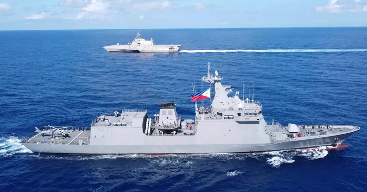 Philippine forces sail to hotly disputed shoal without incident for first time since deal with China