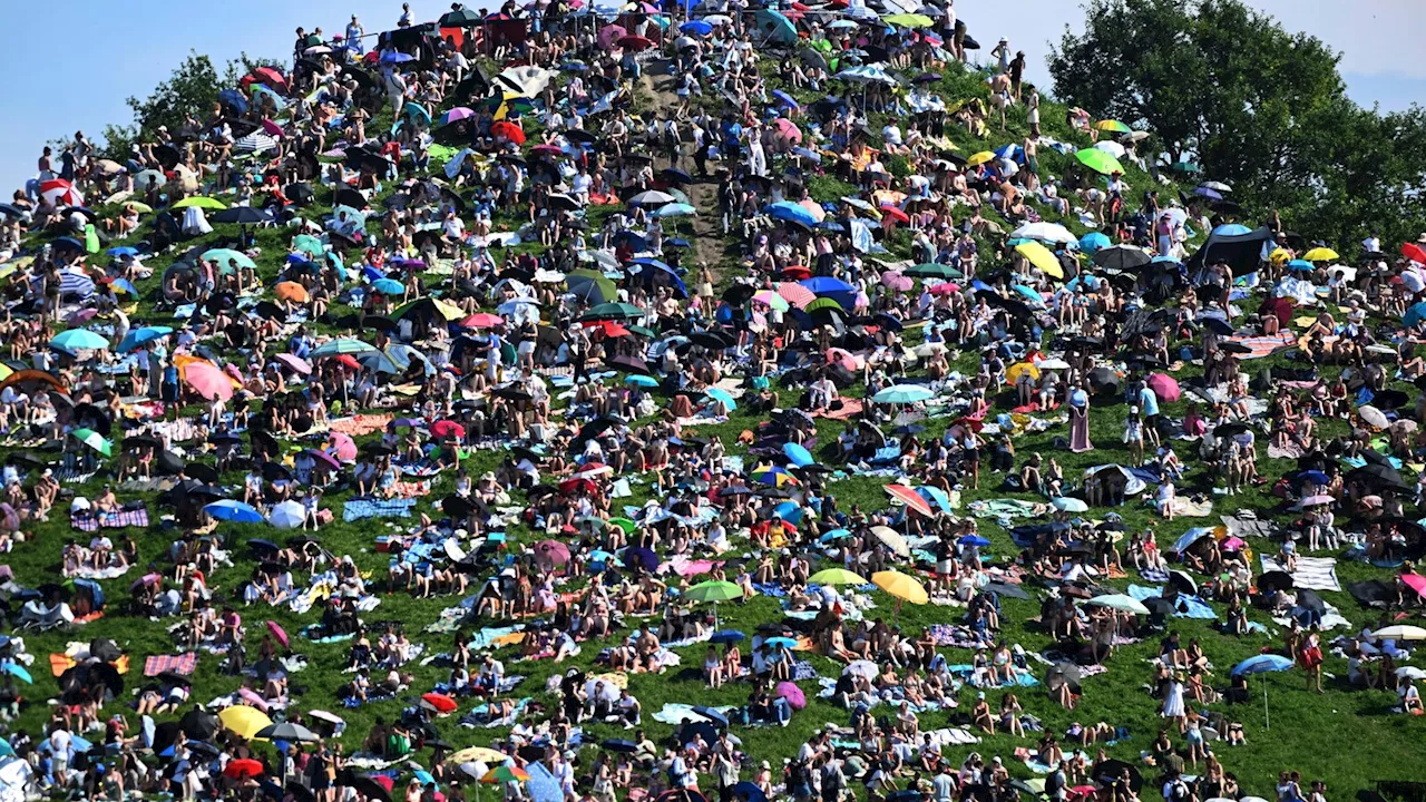 Fans swarm hill in Munich, claiming a high perch for watching Taylor Swift concert