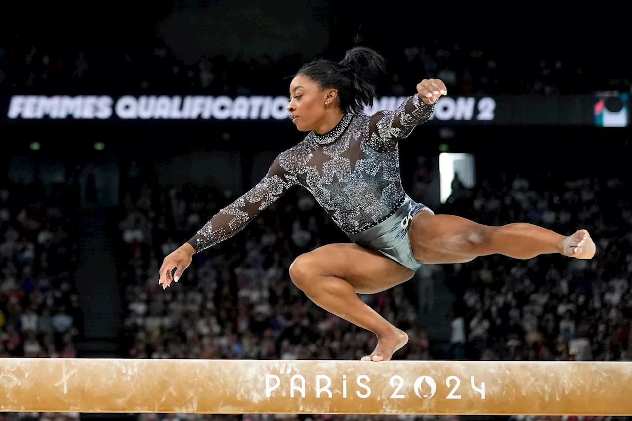 Simone Biles shakes off calf injury to dominate during Olympic gymnastics qualifying