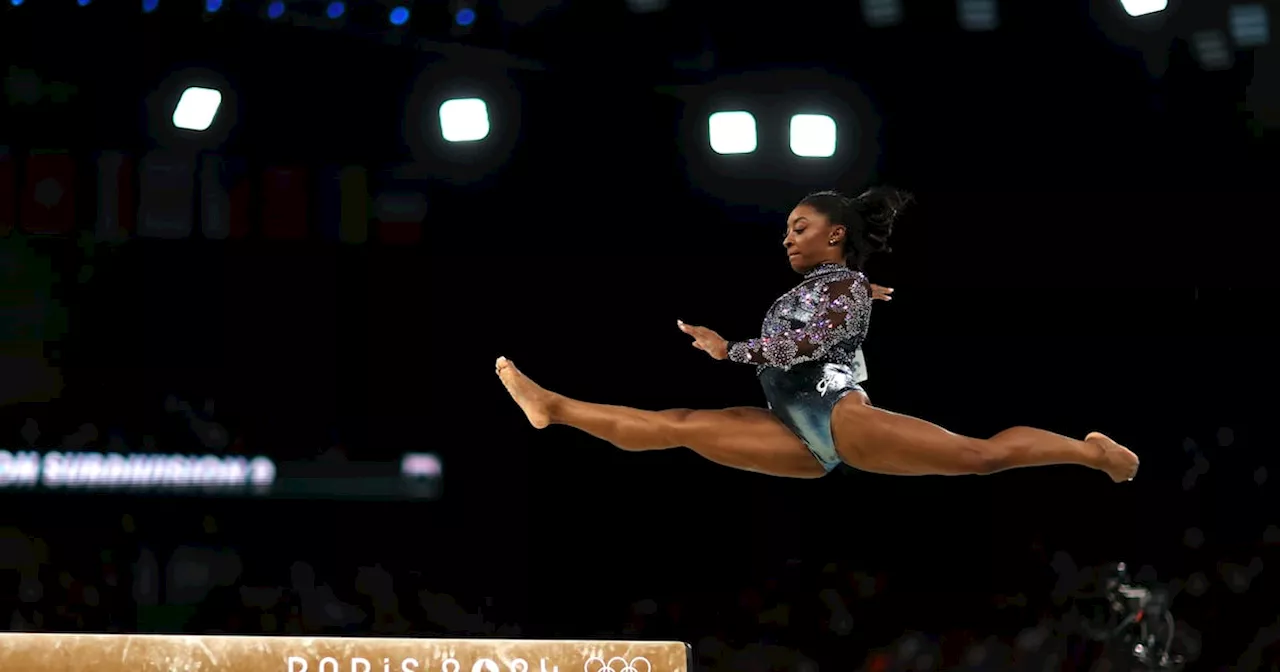 Simone Biles battles through pain on spectacular Olympic return with top score in qualifying