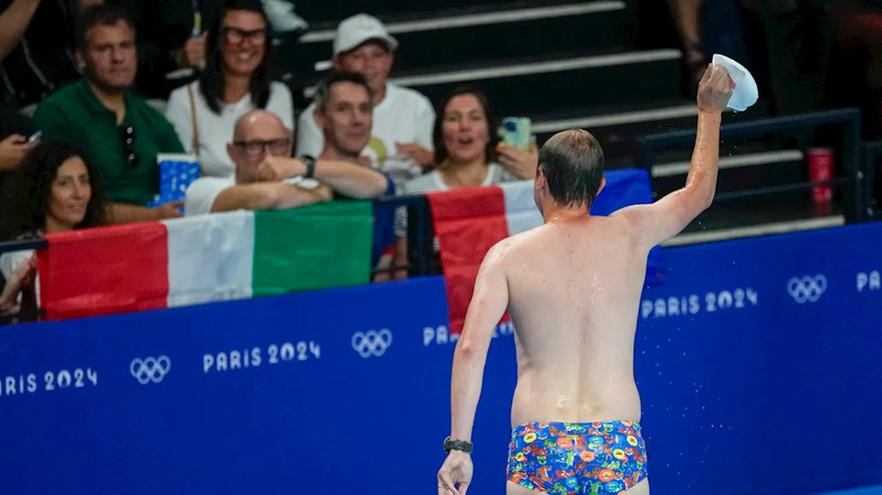 Pool worker strips to his briefs to retrieve lost swim cap, drawing whistles from fans