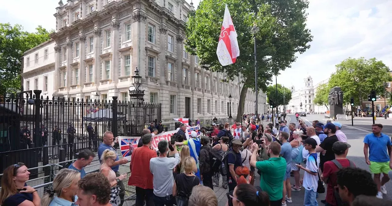 Protesters gather outside Downing Street after reported arrest of Tommy Robinson