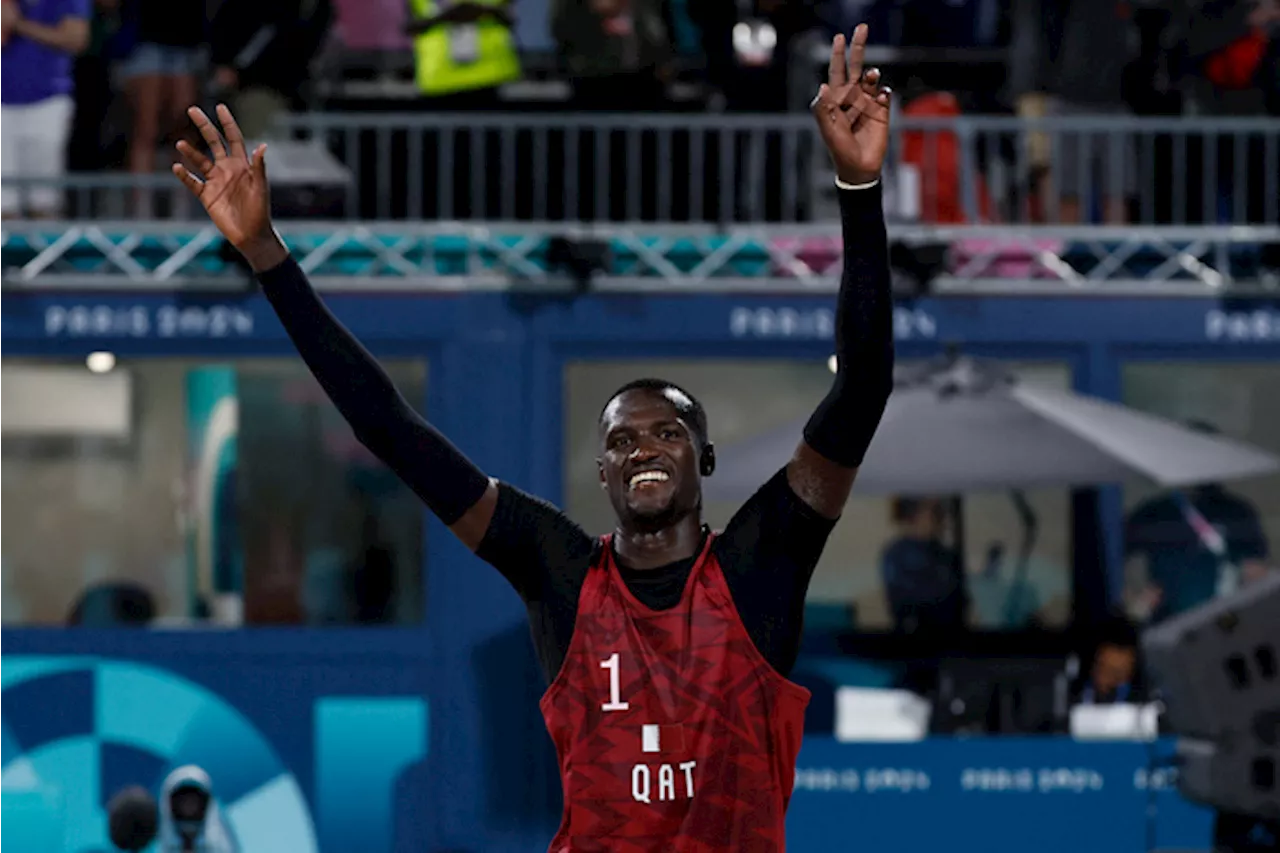 Olympic beach volleyball starts in drenching rain under Eiffel Tower