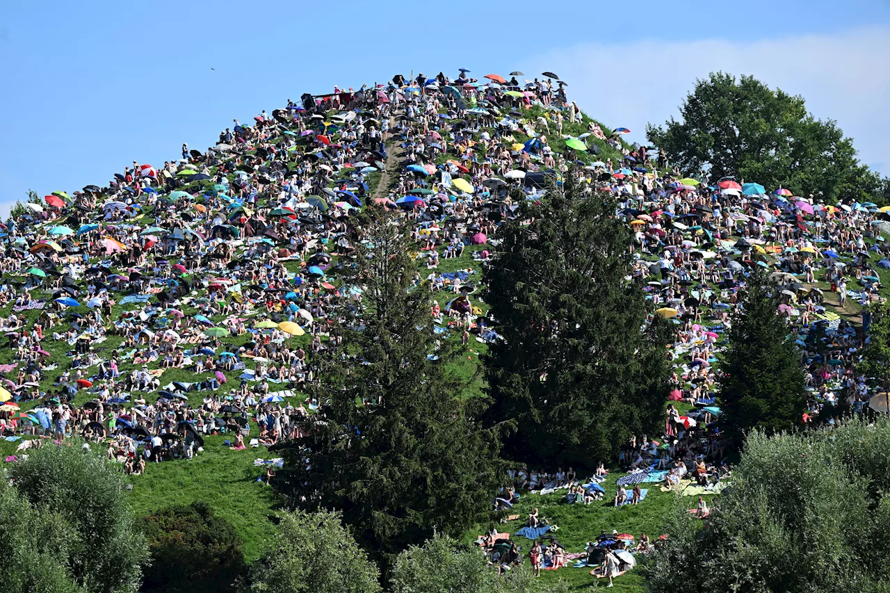 Fans swarm hill in Munich, claiming a high perch to watch Taylor Swift concert for free