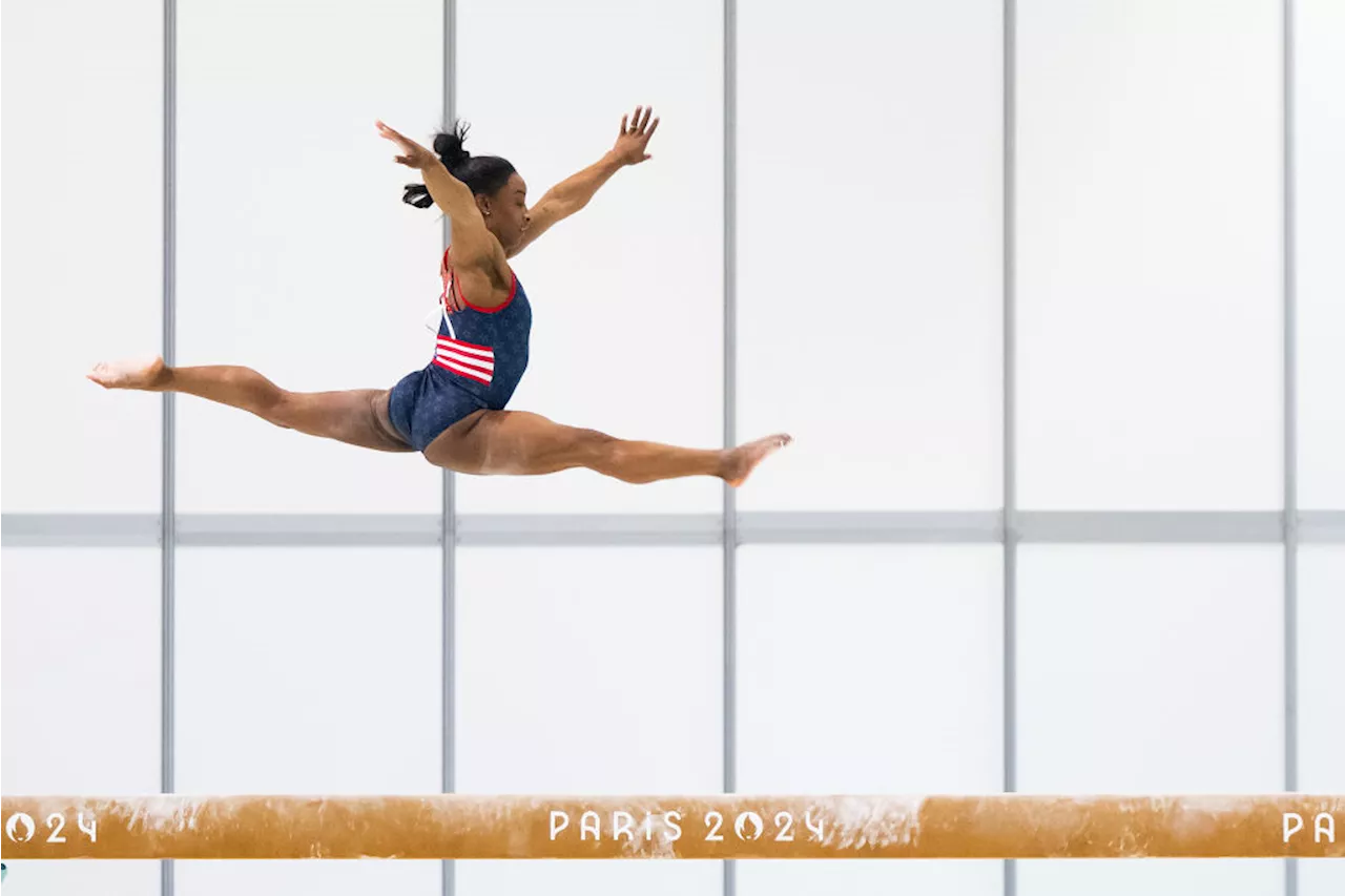 Simone Biles shakes off injury to stun in Olympic qualifying — with Snoop in front row