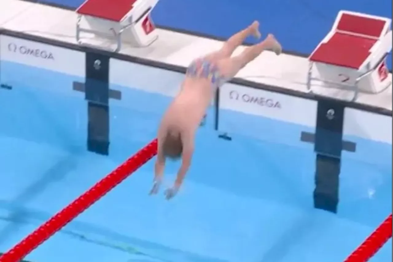 Olympics worker becomes unexpected hero as he strips to jazzy trunks to retrieve swimming cap...