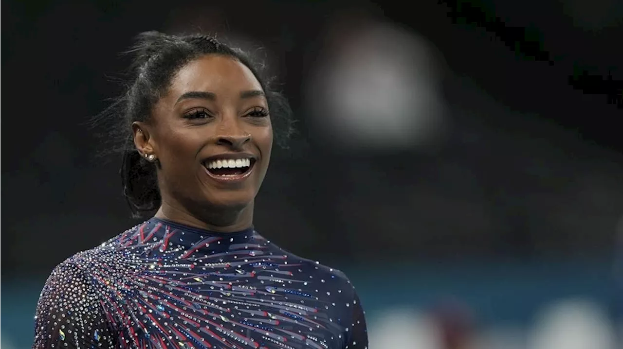 Biles says she has calf discomfort during qualifying but keeps competing