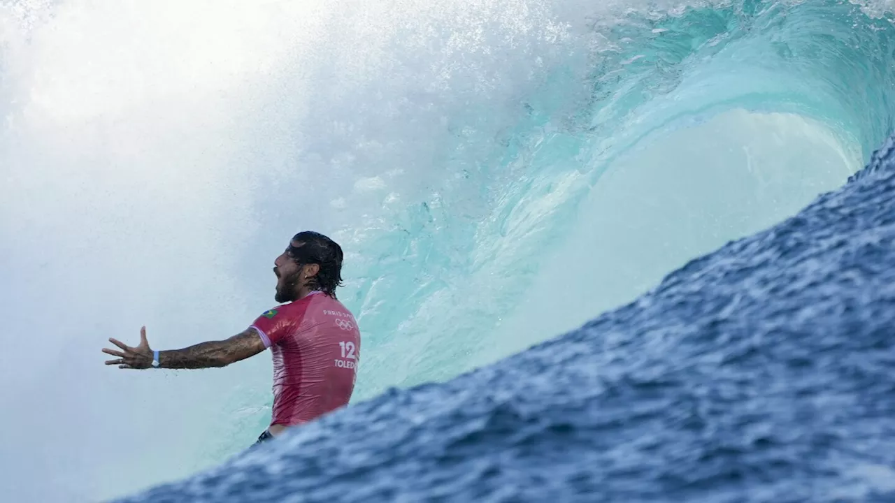 Jubilation and disappointment seen on shore as Paris Olympics surfing eliminations begin in Tahiti