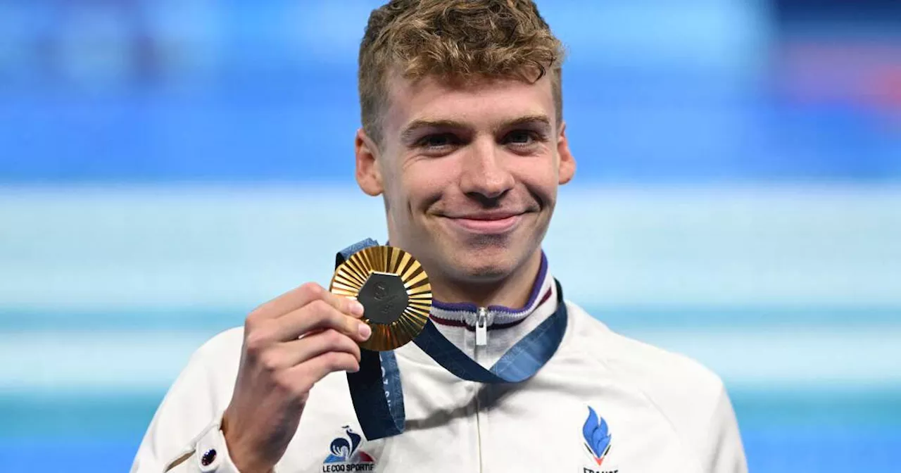 Léon Marchand remporte l’or, un record olympique “et le cœur de la France”