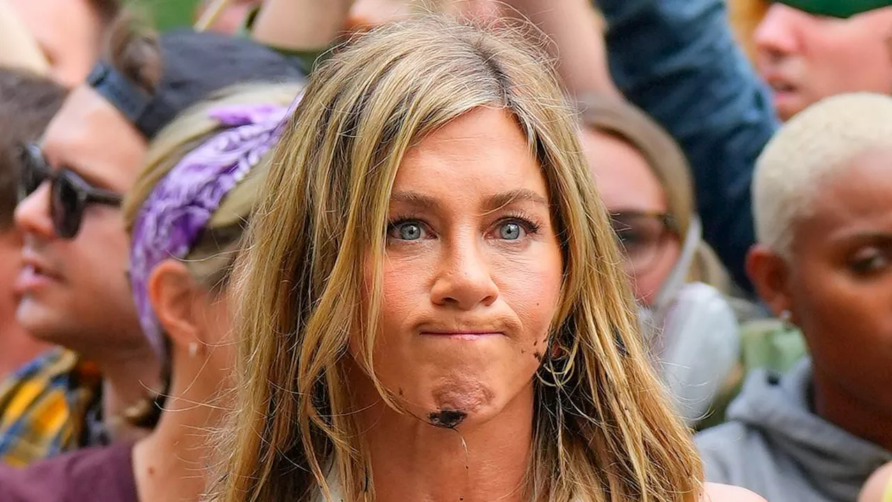 Jennifer Aniston looks FURIOUS when oil is thrown on her during a climate change protest