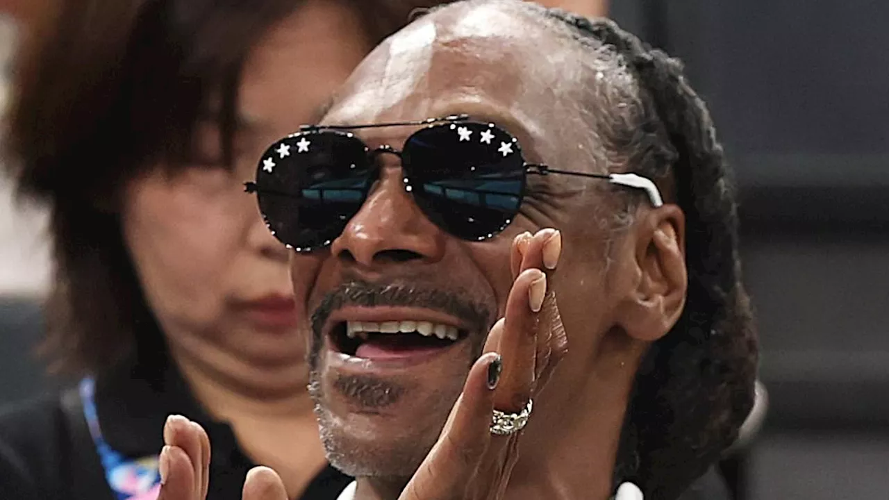 Snoop Dogg proudly supports Team USA in a patriotic tracksuit during Women's Gymnastics...