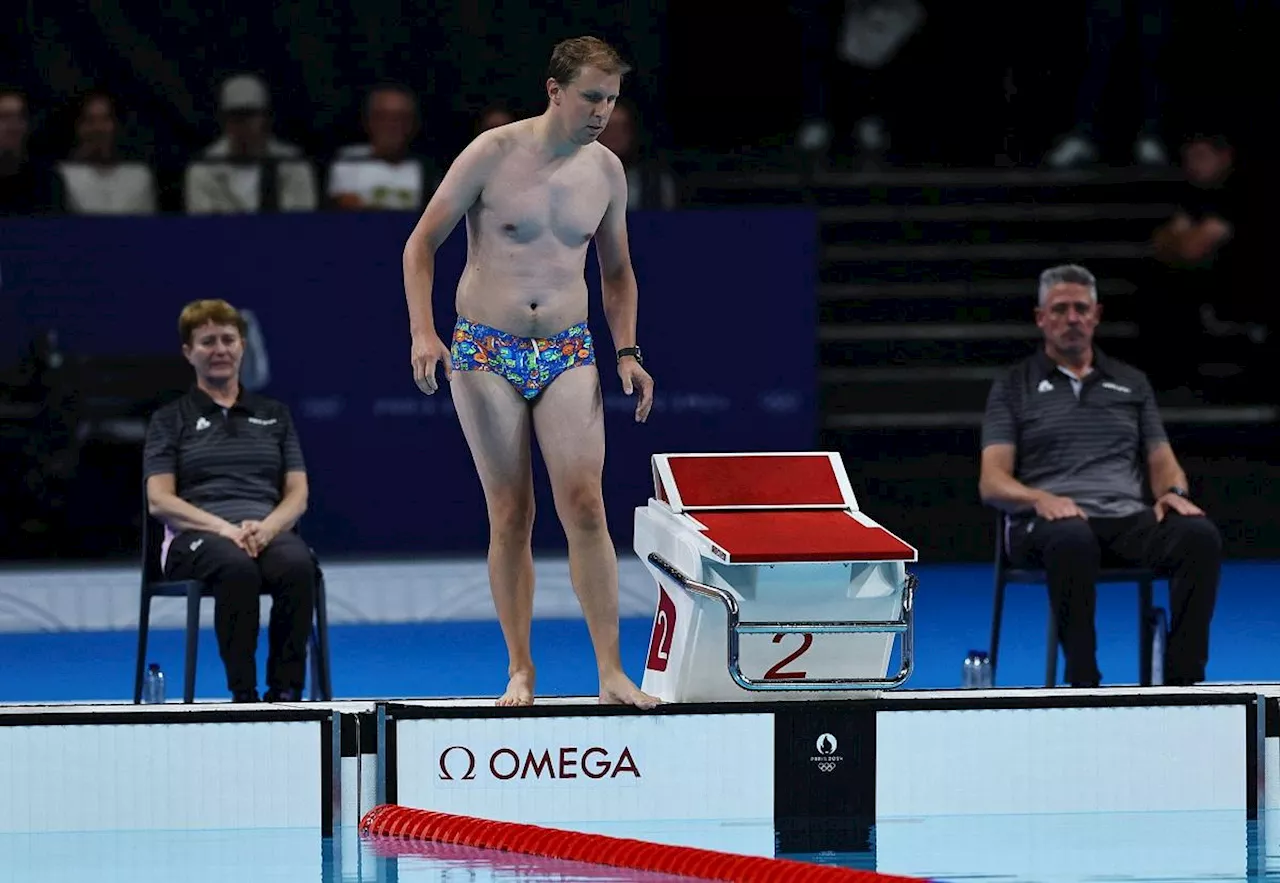 Mystery man goes viral after dive into Olympics pool to retrieve lost cap