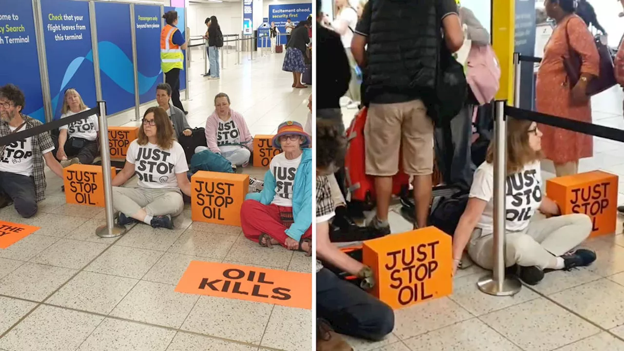 Passengers step over Just Stop Oil activists blocking Gatwick departures