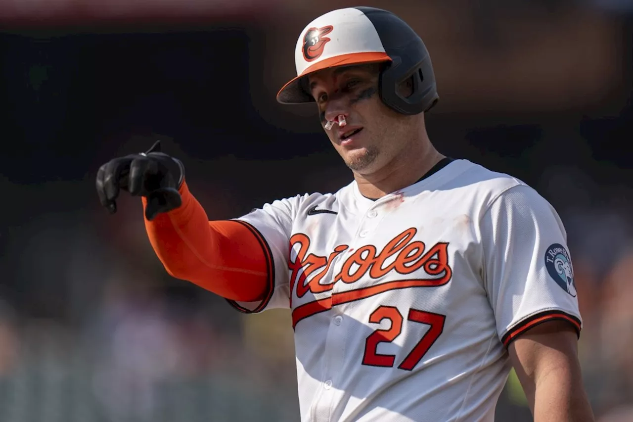 Orioles catcher McCann shrugs off fastball to face, stays in game against Jays