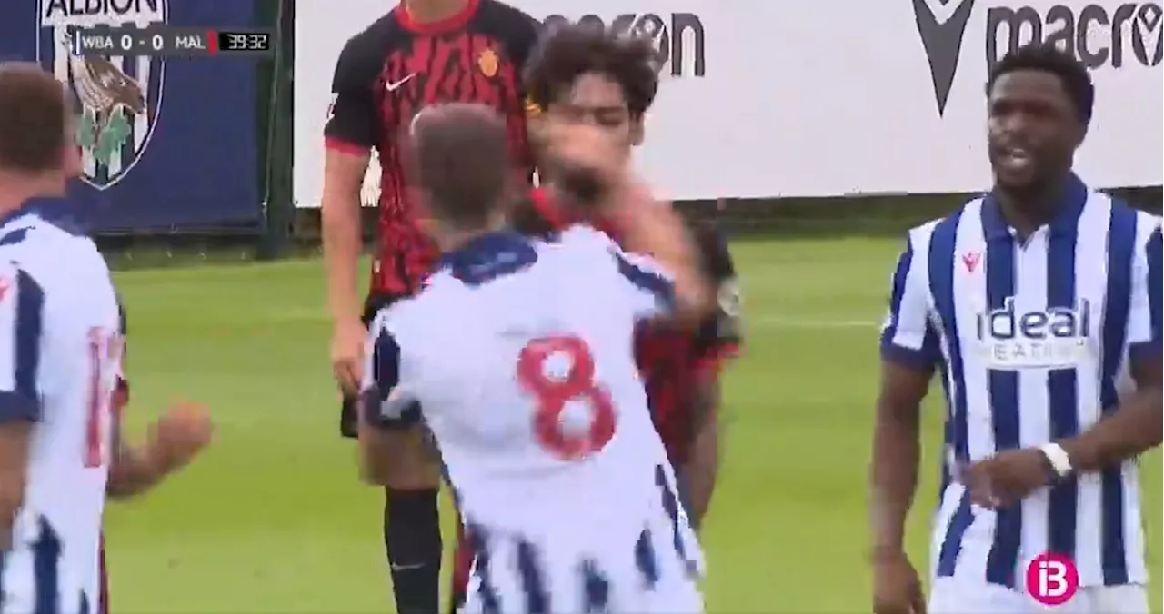 West Brom player Jayson Molumby punches opponent in the face during pre-season clash against Mallorca...