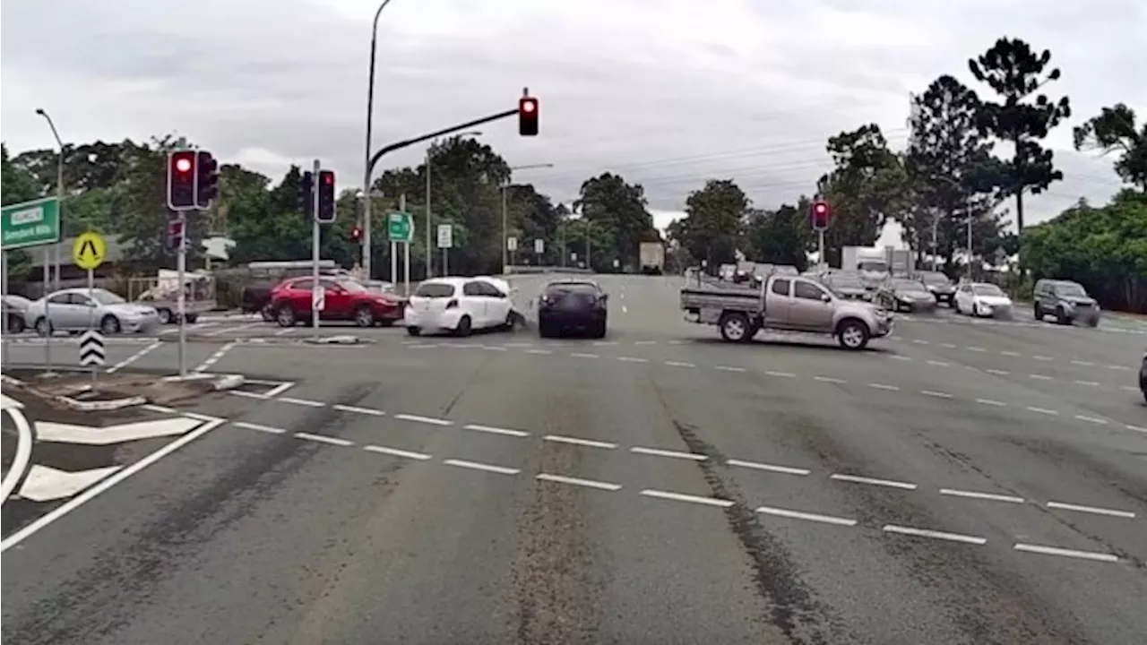 Heart-stopping moment car bolts through red light, hitting two vehicles