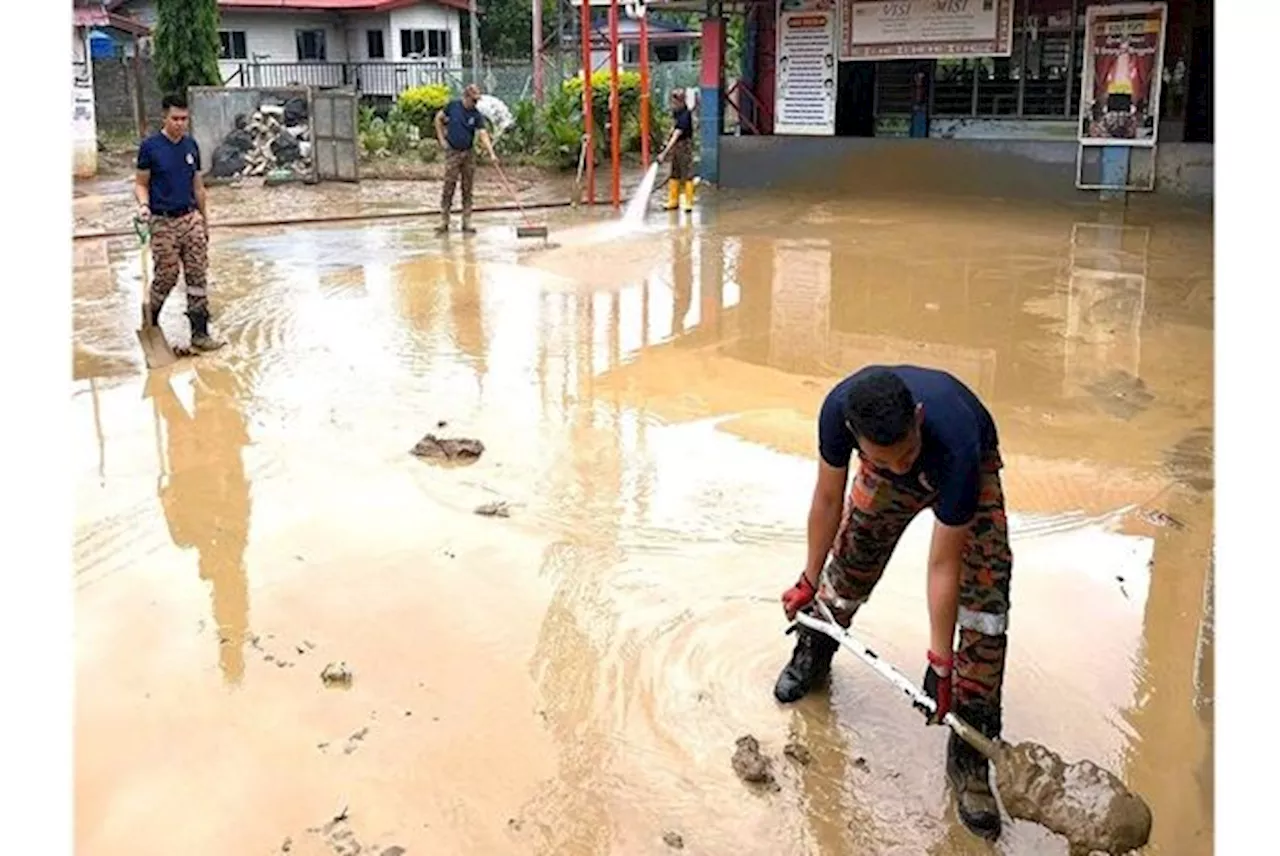 'Abang Bomba' clean-up crews help flood-hit schools in KK, Penampang