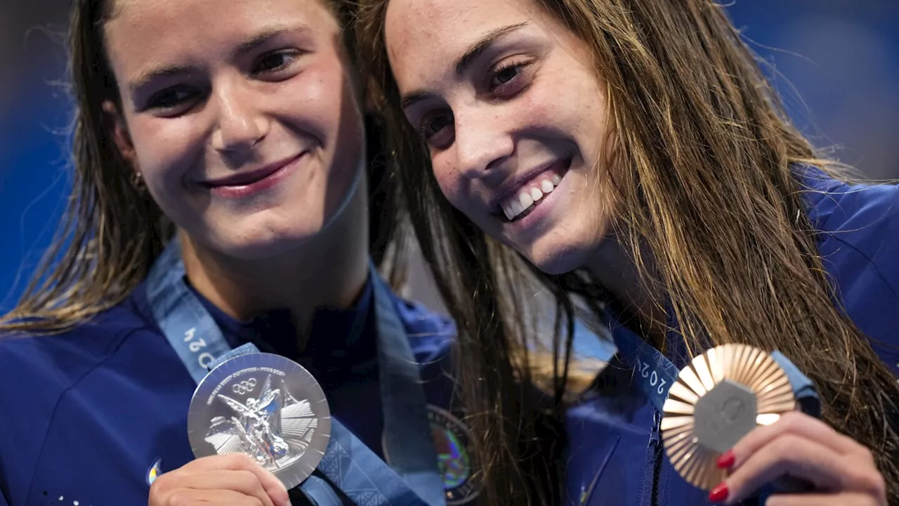 American swimmers grabbed plenty of hardware Monday at the Olympics, but no gold