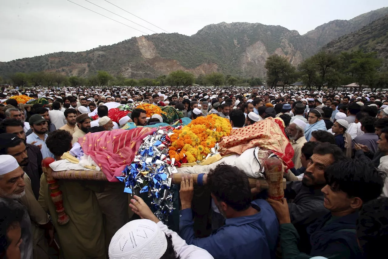 Flash flooding triggered by heavy monsoons kills at least 14 people in northwest Pakistan