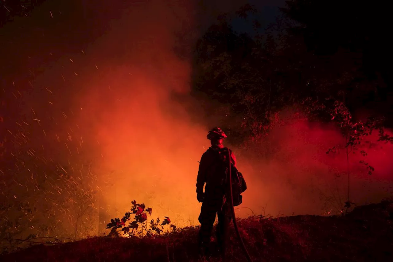 California firefighters make progress as wildfires push devastation and spread smoke across US West