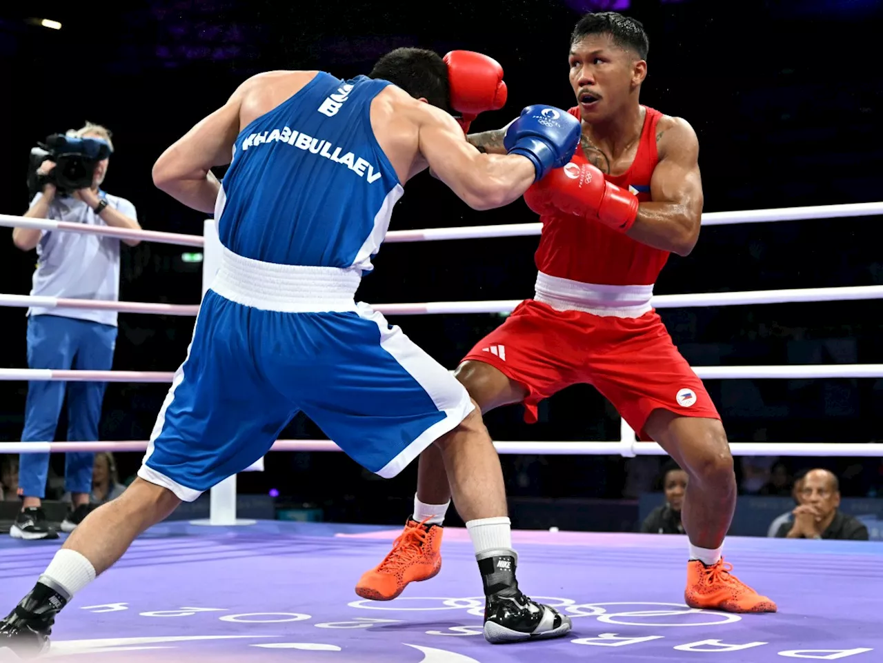 Marcial falls to taller, younger Uzbek foe, says he's undecided on future Olympic plans