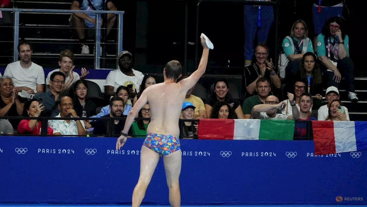 'Mystery man' goes viral after dive into Paris Olympics pool to retrieve lost cap