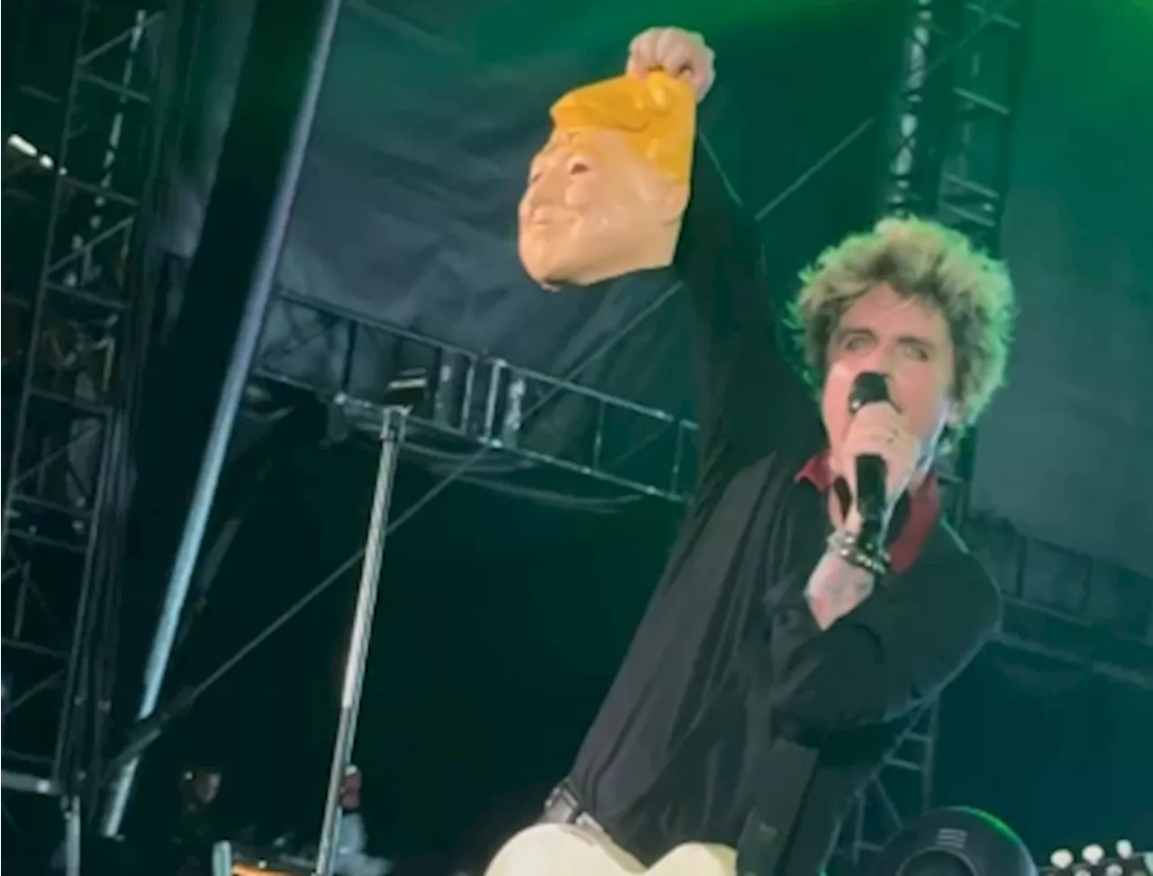 Green Day's Billie Joe Armstrong faces backlash for holding up Trump mask with ‘IDIOT’ written across after recent assassination attempt