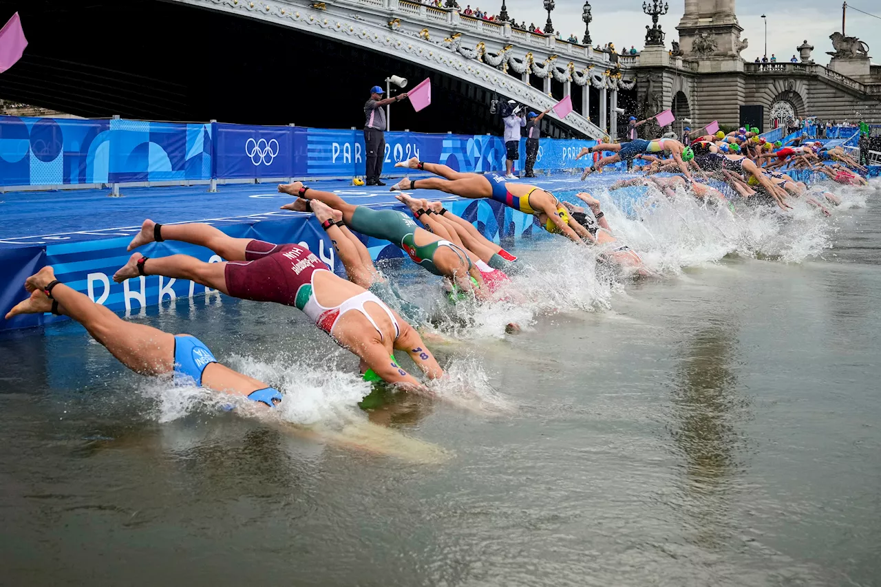 Olympic triathletes swim in Seine River after days of concerns about water quality