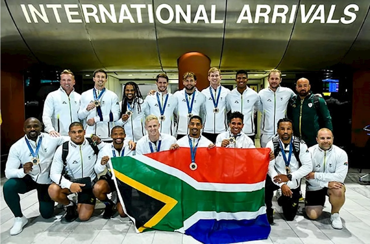 Family, friends welcome buzzing Blitzboks home after 'hard words' sparked bronze revival