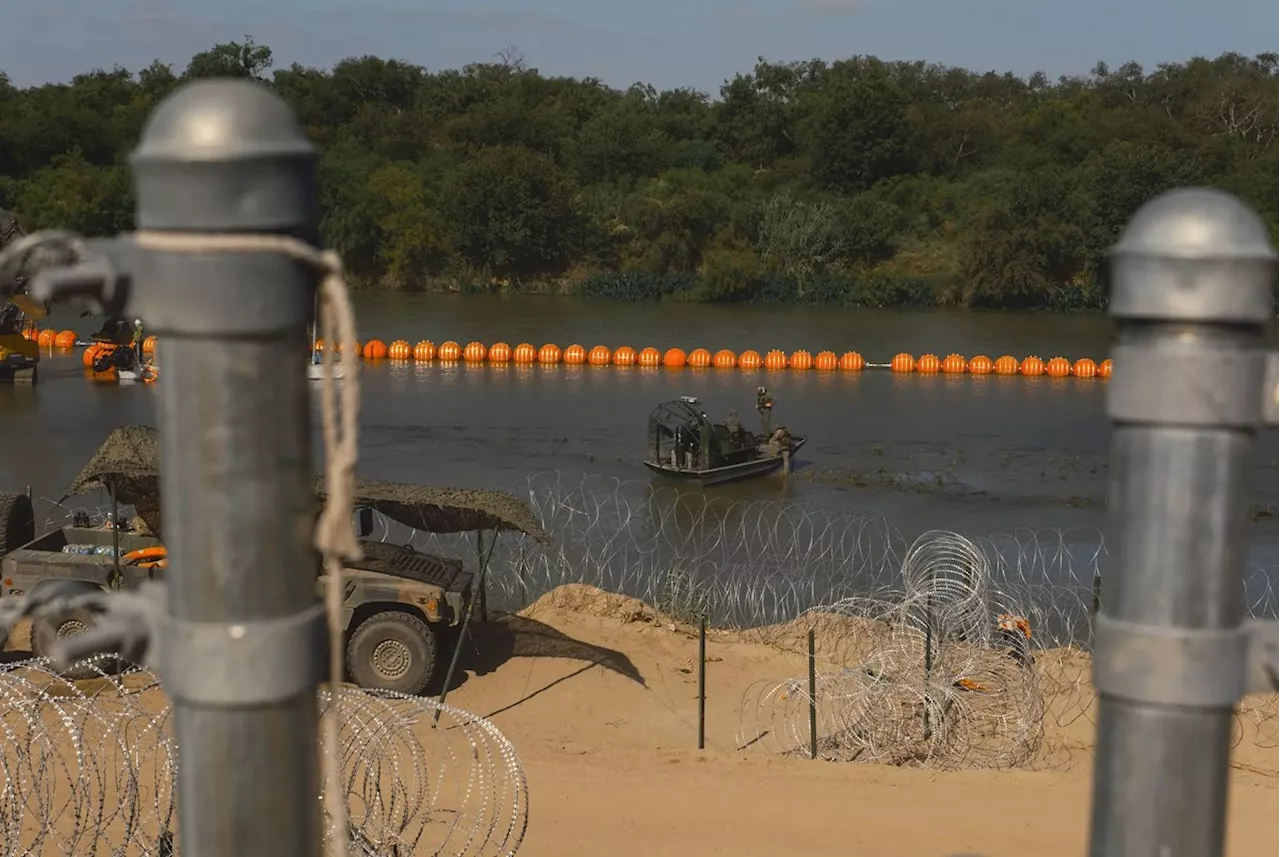 Texas’ floating barrier in the Rio Grande can stay for now, appeals court says