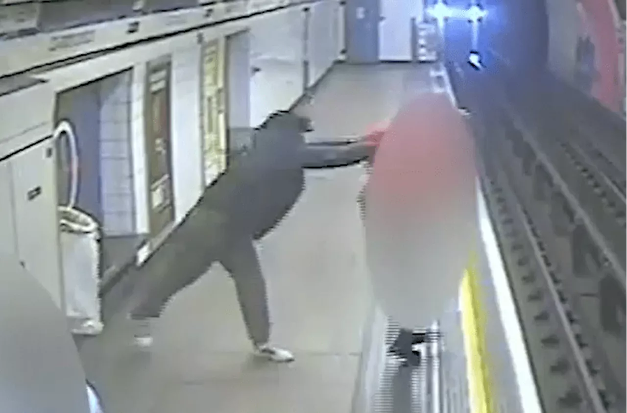 Terrifying moment thug shoves innocent postman on to Tube tracks just as train pulls into busy station...