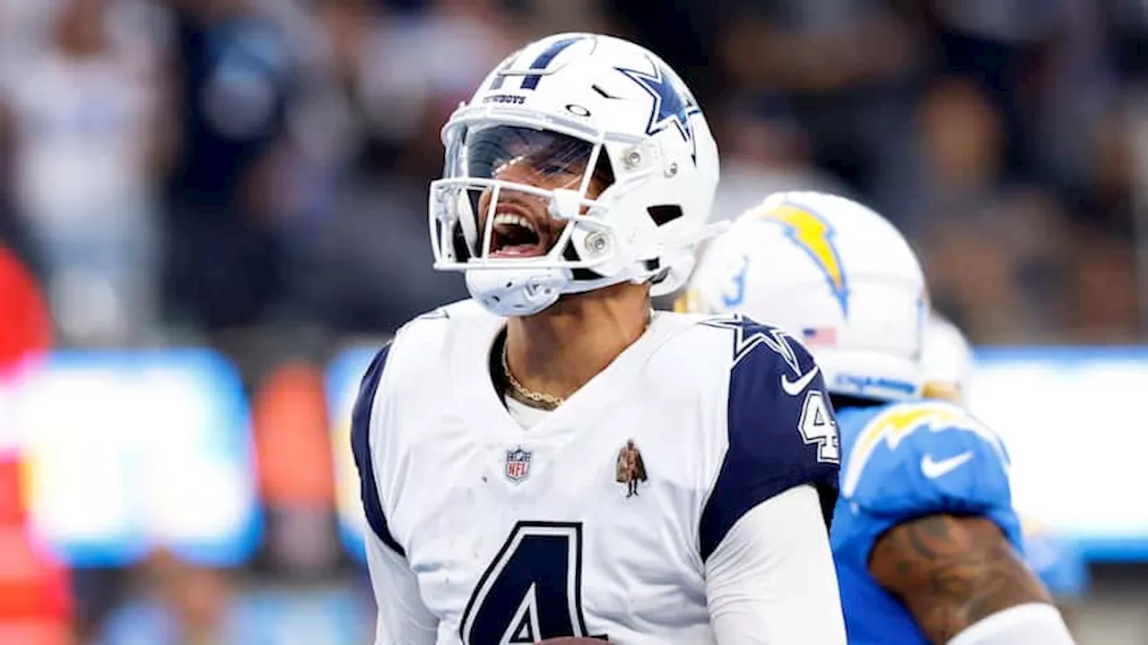 Dallas Cowboys QB Dak Prescott (foot sprain) seen in walking boot