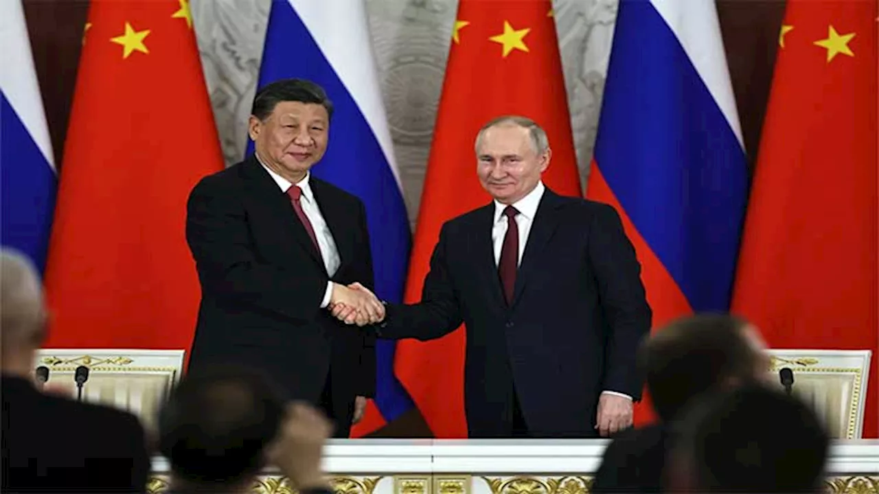 Leaders of Russia and China meet at a Central Asian summit in a show of deepening cooperation