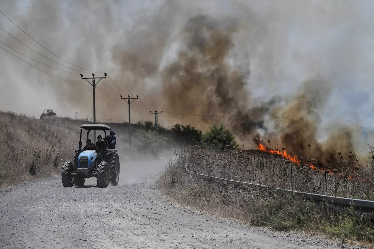 Hezbollah fires over 200 rockets into Israel after killing of senior commander