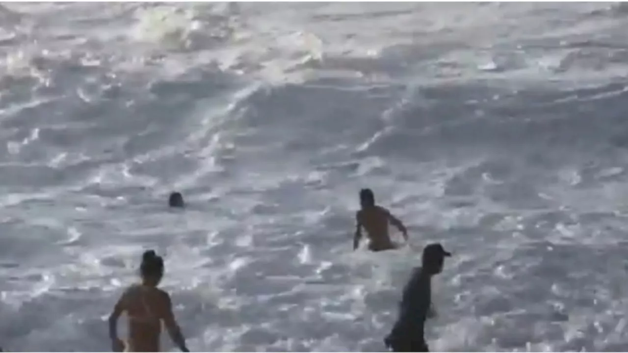 VIDEO: el heroico momento en que un surfista salva a una mujer de ser devorada por el mar de Hawái