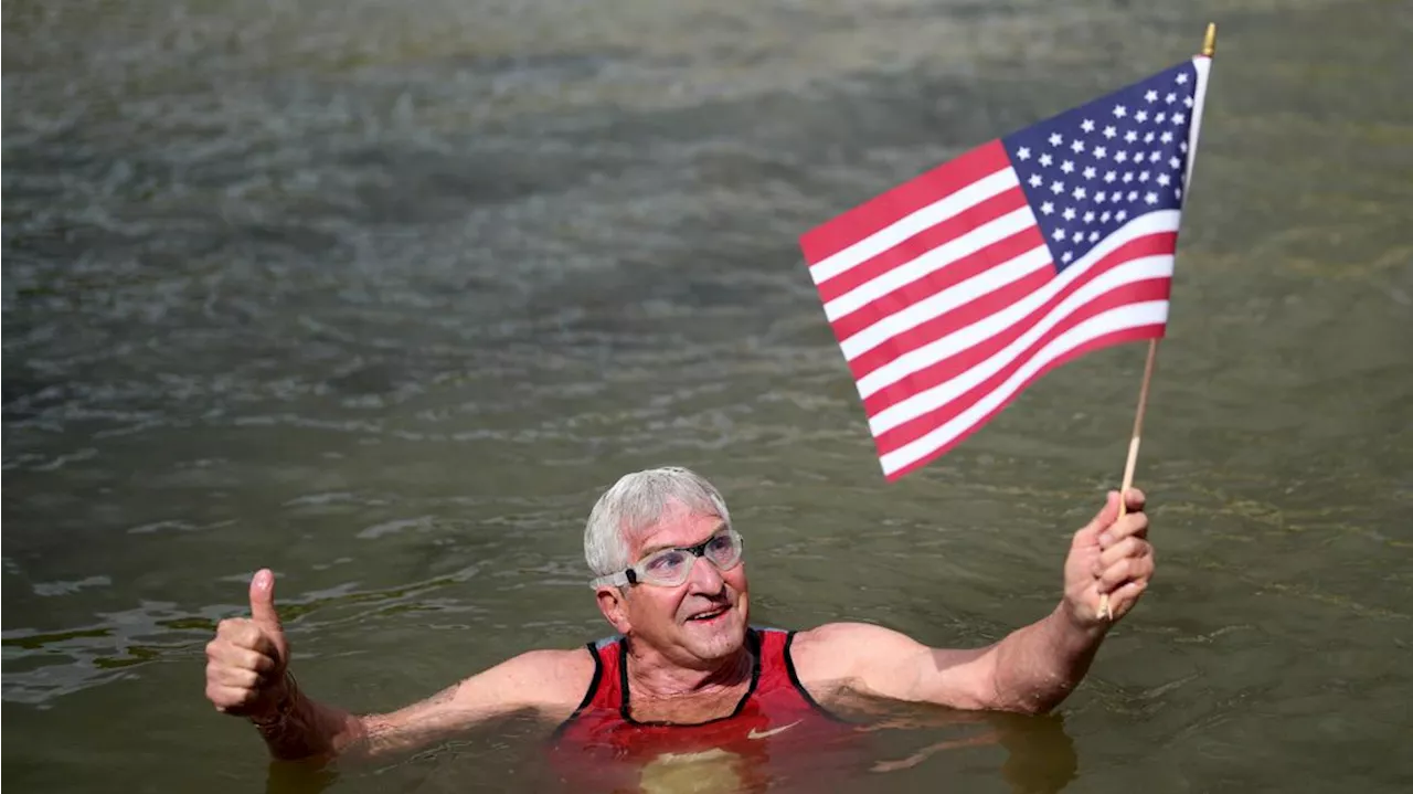 An American swims in Paris' Seine River before the Olympics despite contamination concerns