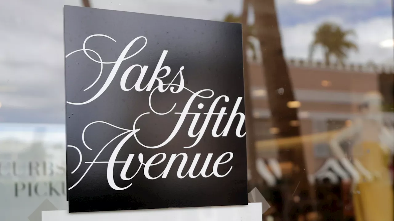 Luxury department store Saks buys Neiman Marcus, and Amazon gets a stake