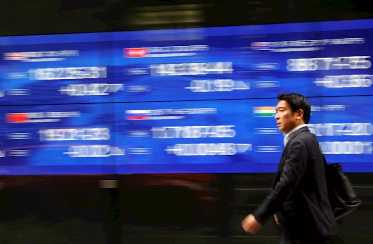 Asia stocks hit 27-month top, dollar slips on rate cut talk