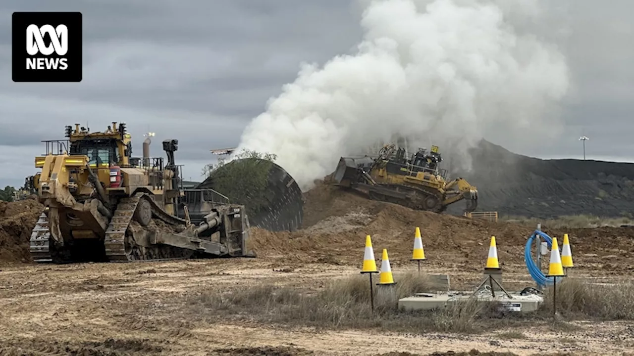 Dirt, foam, jet engine called in to fight central Queensland coal mine fire