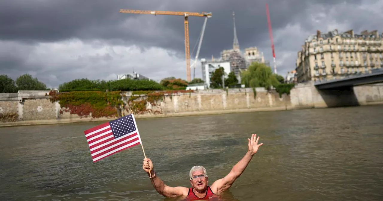 An American swims in Paris' Seine River before the Olympics despite contamination concerns