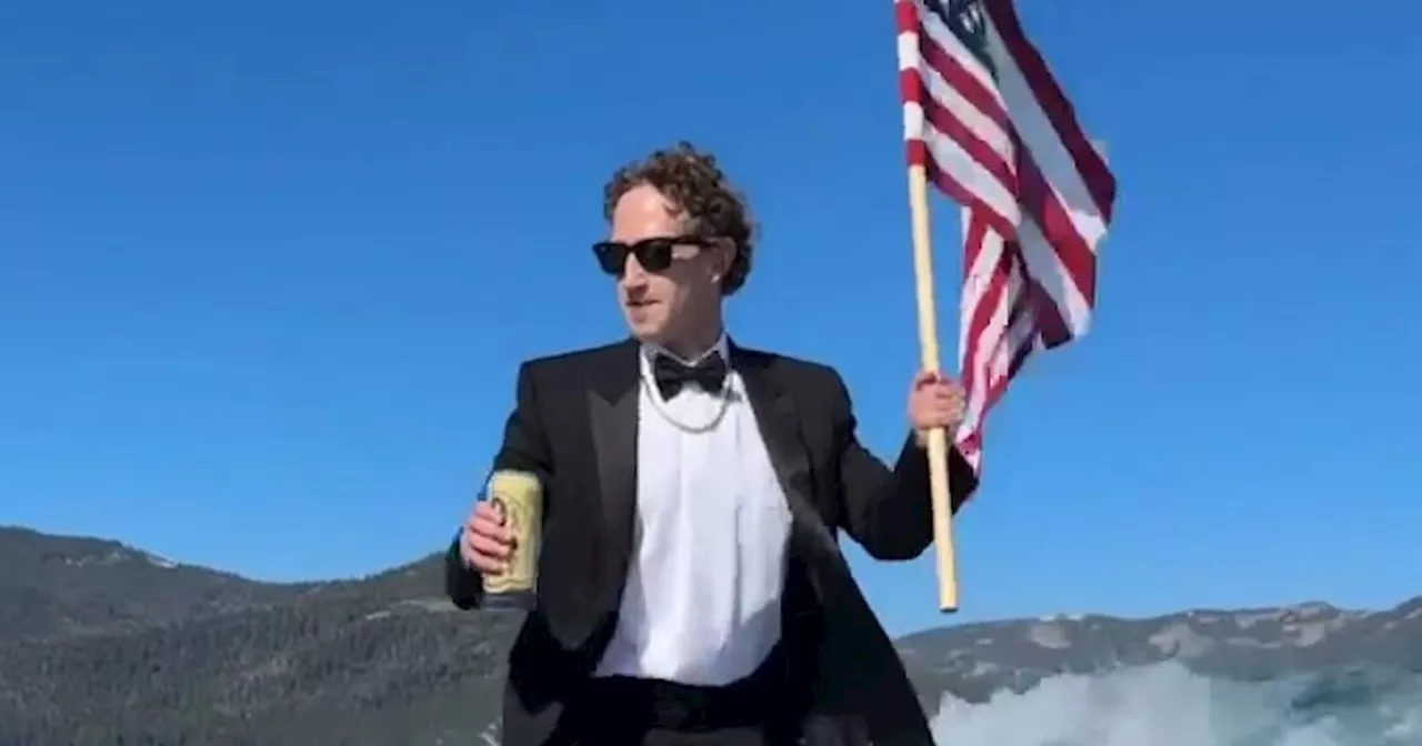 Mark Zuckerberg surfs while drinking beer, holding flag. Rival Elon Musk can’t resist snark